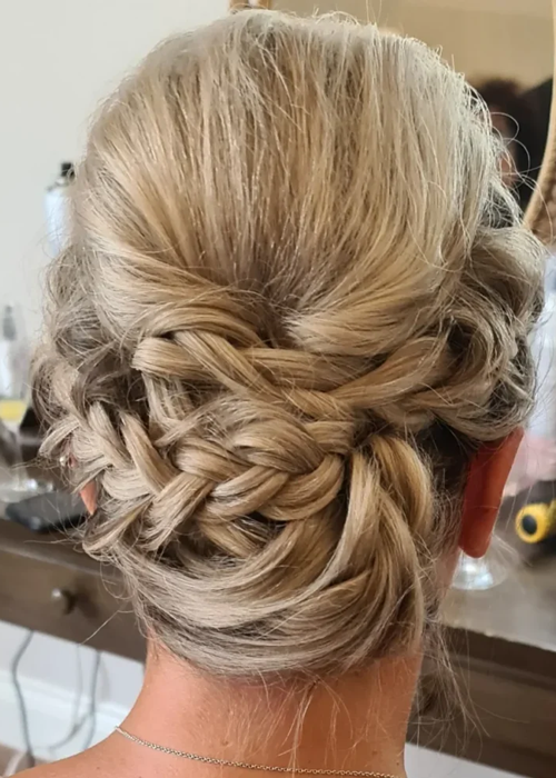 Criss cross plaited hairstyle on a bride with blonde hair.