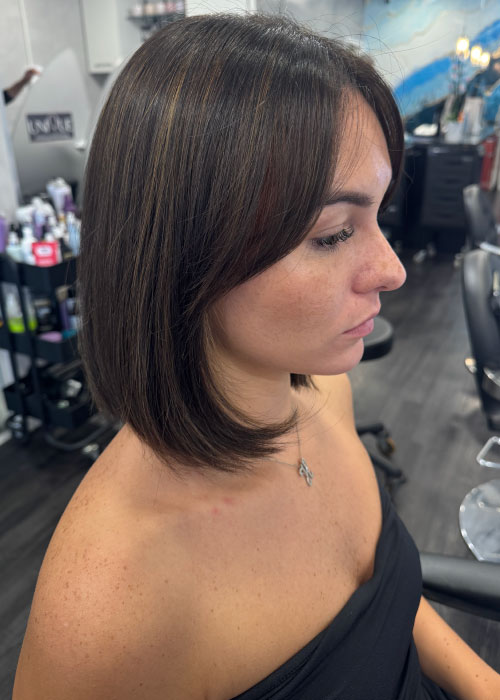 Woman with a sleek bob haircut at Unique Hairdressing in Bishop's Stortford.