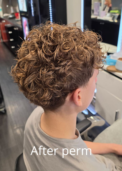 A boy's hair after getting a hair perm.